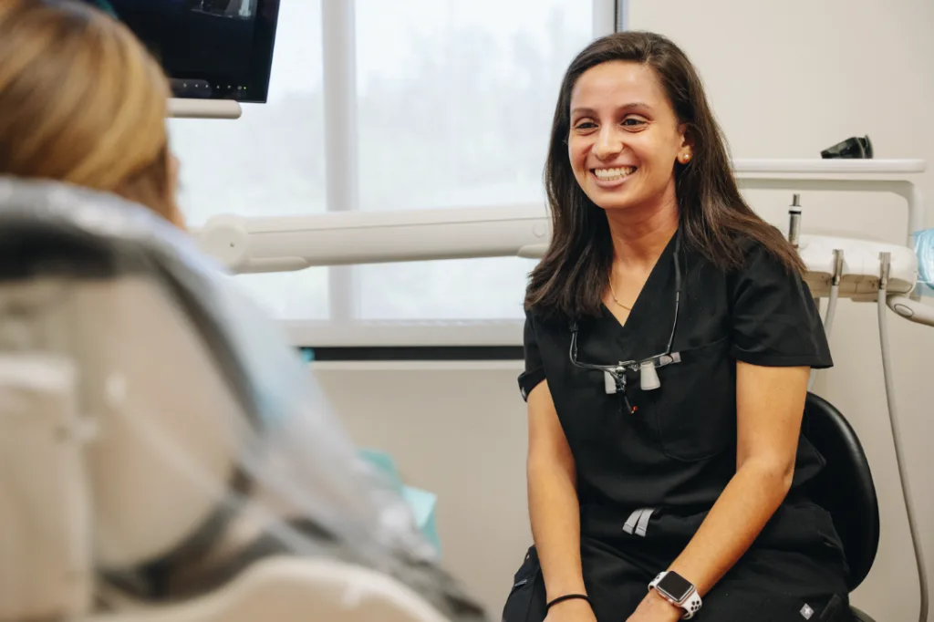 A Providence Dental Spa dentist smiling with a patient